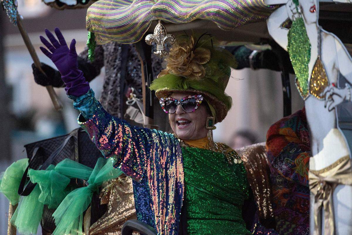 A float rider waves to the crowd during Mystic Krewe of the Seahorse’s Lundi Gras parade in Bay St. Louis on Monday, March 3, 2025.