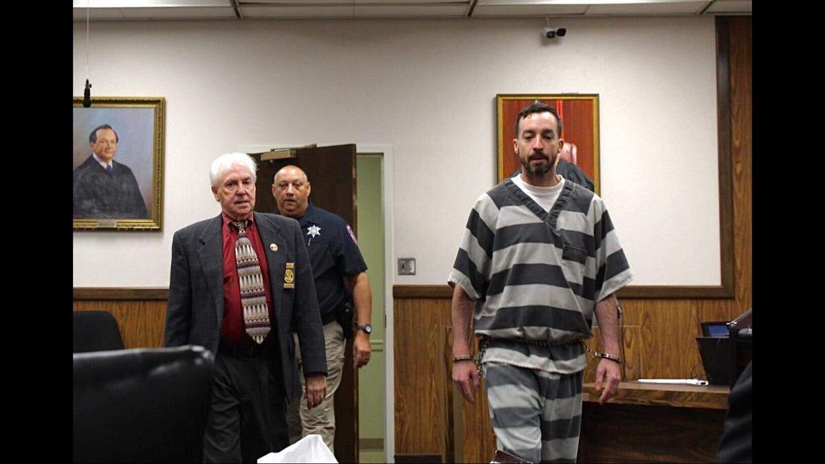 Former Diamondhead councilman Alan Moran is escorted into Circuit Court in Gulfport on Aug. 6, 2025.