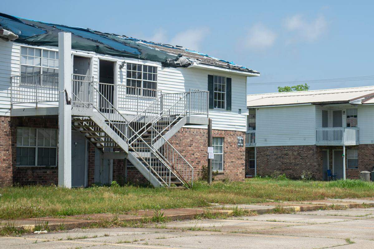 A damaged building with a missing roof at the Gulf Grove Apartments in Waveland on Friday, April 19, 2024. The city of Waveland condemned the apartments over the condition of the buildings and residents will have 30 days to move out.