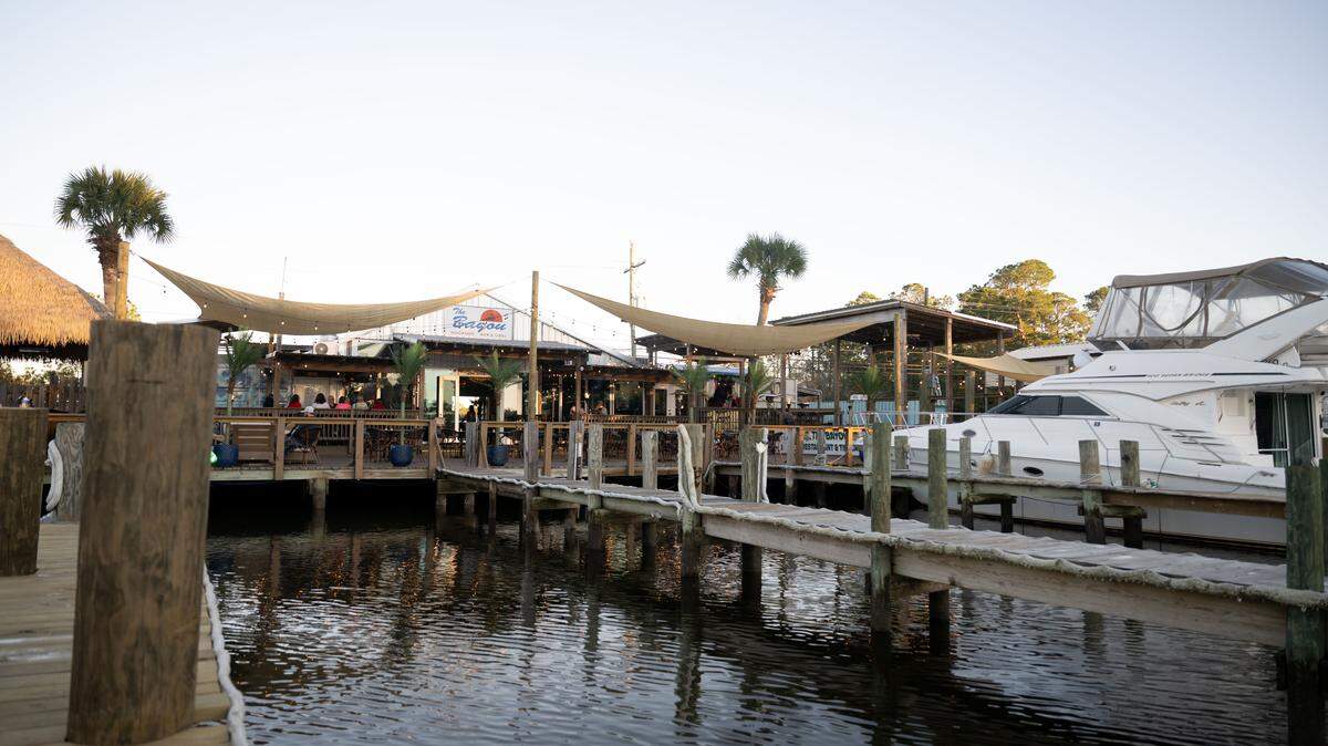 A boat is parked at the dockside dining area at The Bayou Dockside Bar & Grill on Friday, Dec. 19, 2025.