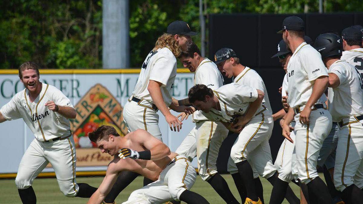 CAMAL PETRO/PINE BELT SPORTS 
 Daniel Keating gets his shirt ripped off as Southern Miss celebrates its 2-1 victory over Rice on Sunday.