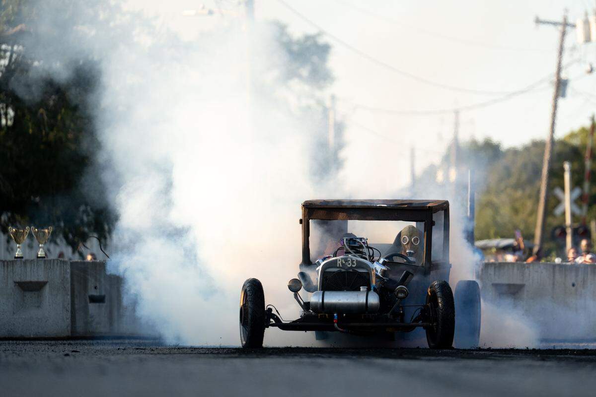 A vintage car produces smoke during Burn ‘Em Up In The Pass on Thursday, Oct. 9, 2025.