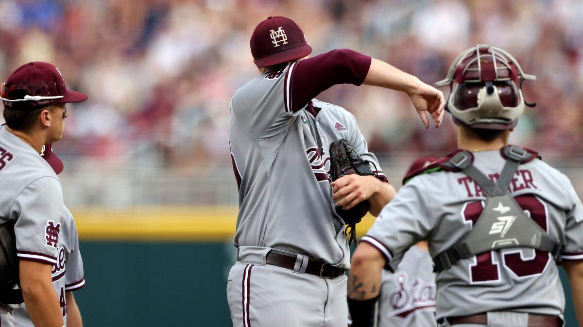 Mississippi State pitcher Christian MacLeod, center, reacts as he is taken out during the first inning against Vanderbilt in Game 1 of the NCAA College World Series baseball finals, Monday, June 28, 2021, in Omaha, Neb. (AP Photo/Rebecca S. Gratz)