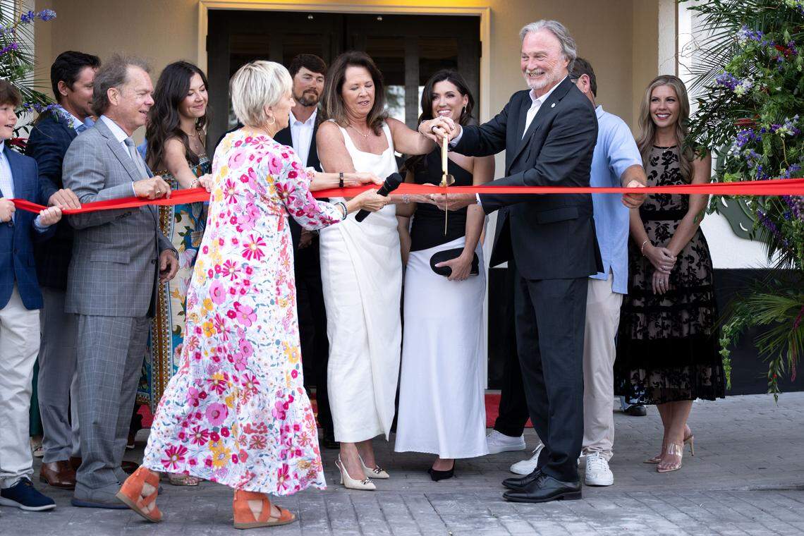 Gulfport Mayor Hugh Keating participates in a ribbon-cutting Thursday at the Markham Hotel in Gulfport.