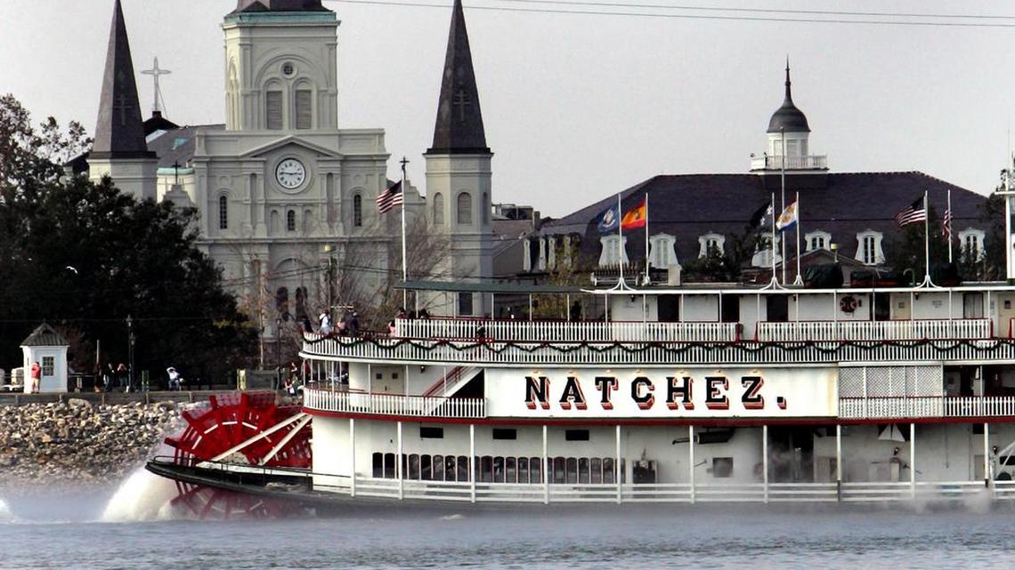 The New Orleans skyline shows St. Louis Cathedral, left, the Presbyterian Building, right, and the Natchez paddle boat headed down the foggy Mississippi River, Saturday, Dec. 31, 2005.