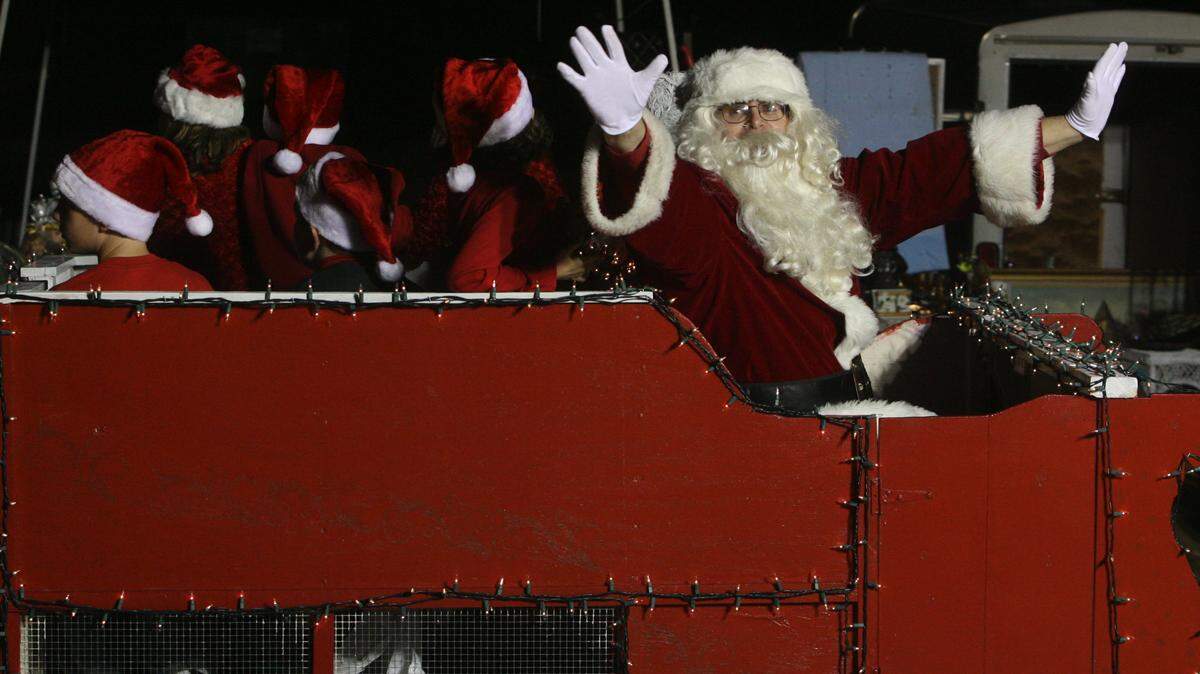 Santa Claus waves to spectators during a previous year’s Christmas in the Pass. The jolly old fella will be a featured guest at many events coming in up South Mississippi, including this year’s celebration in Pass Christian.