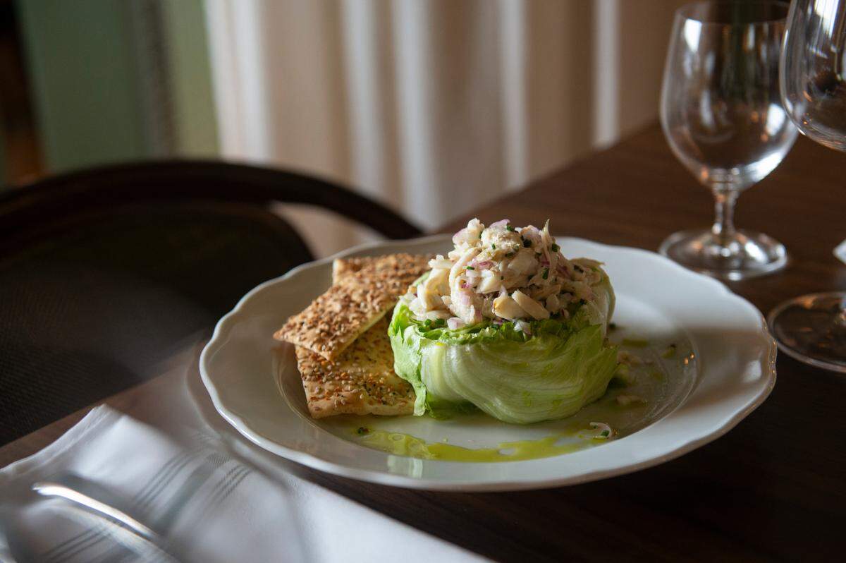 West Indies crab salad is one of the cold appetizers at Coraline’s, made with blue crab and served with crispy flat bread.