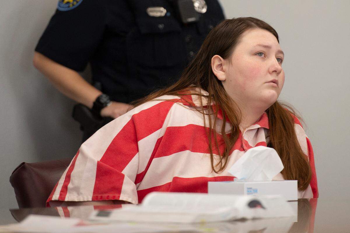 Summer Rose Hill, accused of capital murder in her 6-month-old daughter’s death, listens during a probable cause hearing at County Court in Biloxi on Thursday, Oct. 17, 2024.
