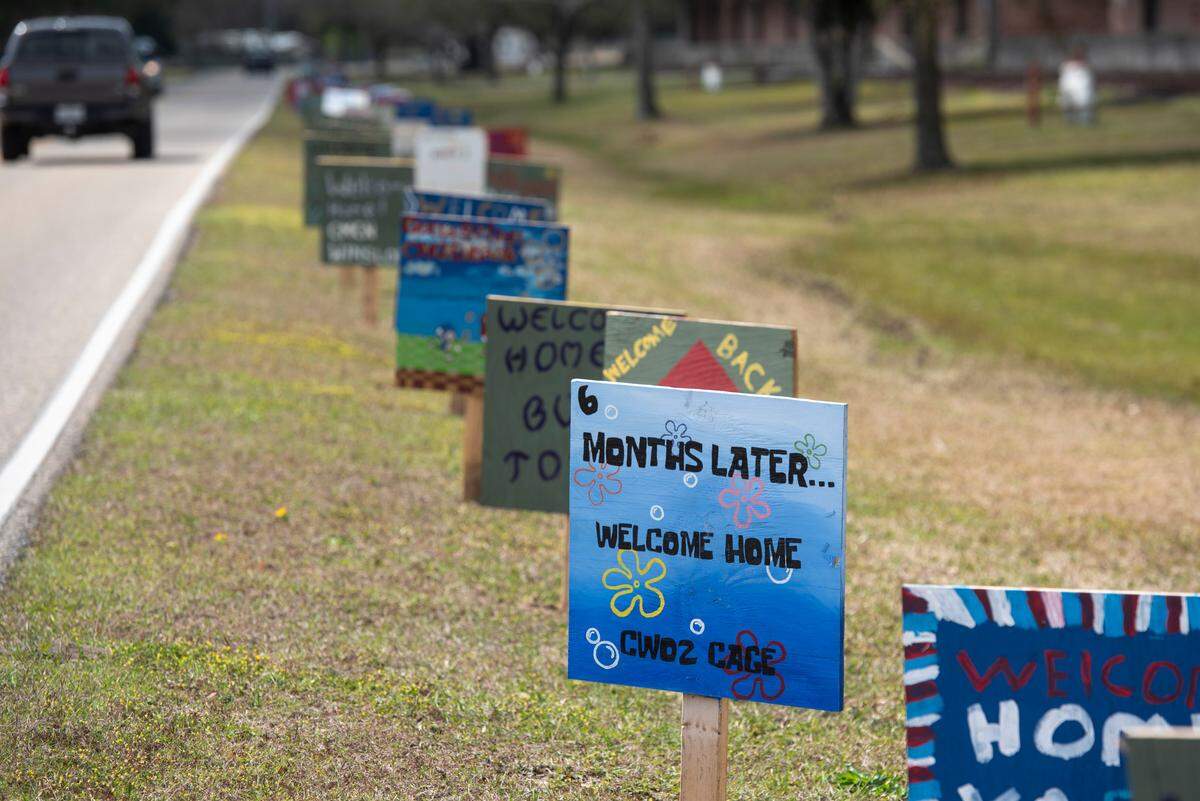 Signs line the roads at Naval Construction Battalion Center Gulfport welcoming home members of Naval Mobile Construction Battalion 1 as they return home from deployment on Thursday, March 13, 2025.