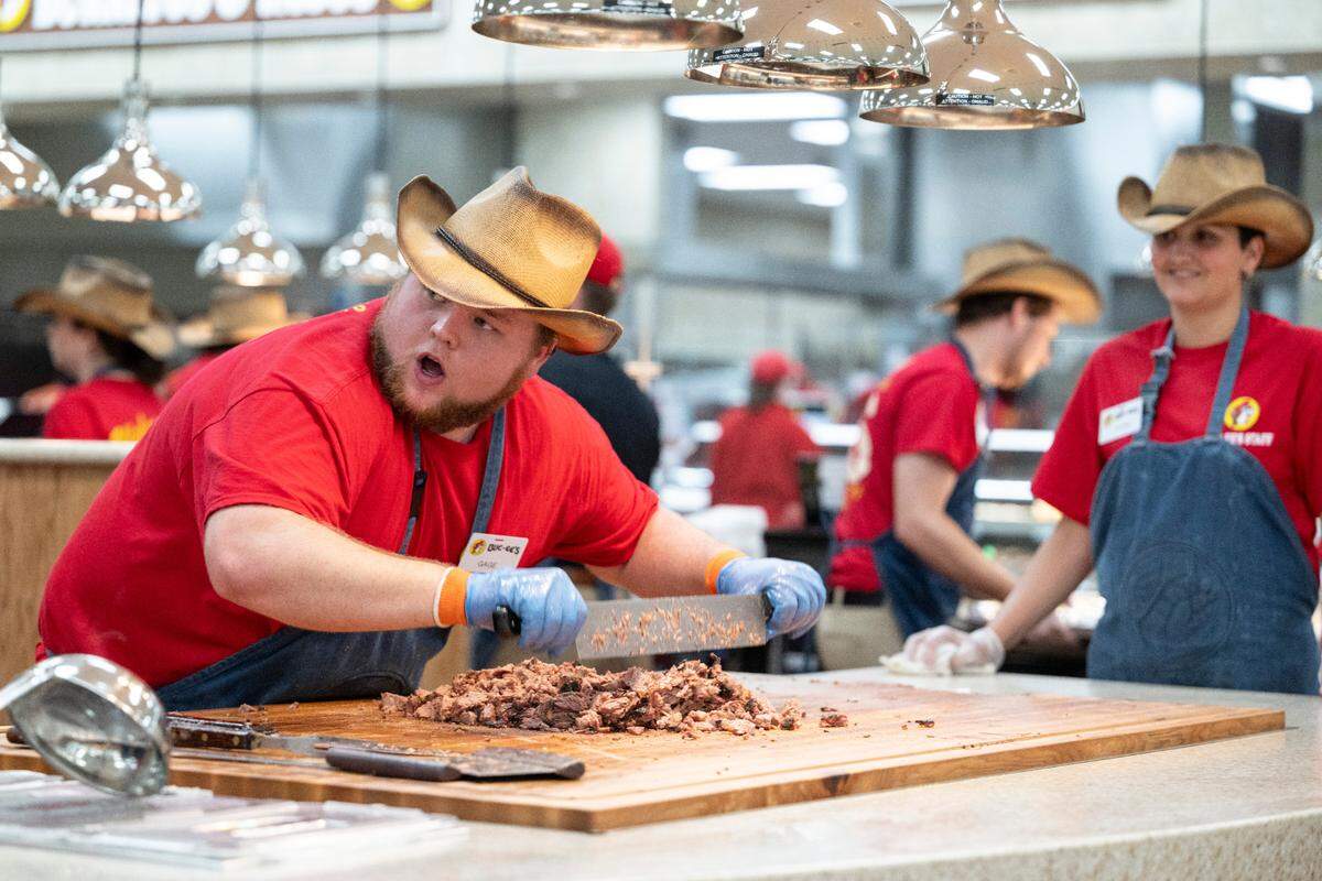 Workers chop brisket during opening day of Buc-ee’s first Mississippi location in Harrison County on Monday, June 9, 2025.
