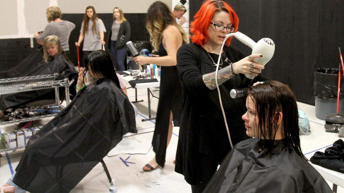 TIM ISBELL/SUN HERALD 
 Christy Garlotte and other stylists volunteered to give haircuts to area homeless, Monday, May 2, 2016, at Mosaic Church in Ocean Springs.