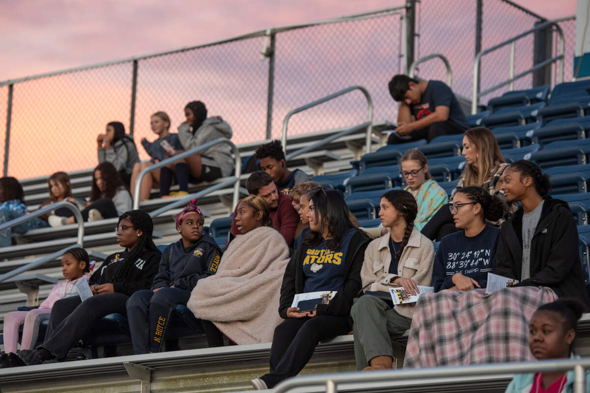 Family, friends and community wait for a candlelight vigil in honor of three Gautier High School graduates to begin at Gautier High School in Gautier on Thursday, Dec. 7, 2023. Se’Dhari Saniya Watson-Person, Kyla “Muffin” Watkins, and Tatyanna Richmond were involved in a fatal crash on Tuesday, leading to the deaths of Watson-Person and Watkins.