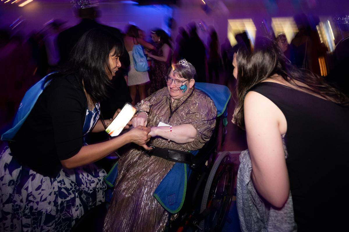 Sue Green is gifted a crown by her buddy during Night to Shine at Woolmarket Baptist Church on Friday, Feb. 13, 2026.