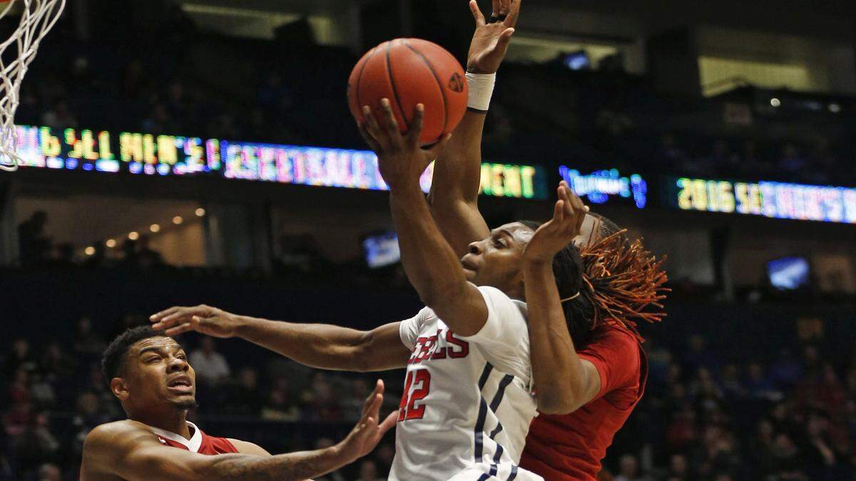 JOHN BAZEMORE/ASSOCIATED PRESSOle Miss' Stefan Moody (42) drives against Alabama's Arthur Edwards (4) in last week's SEC Tournament game.