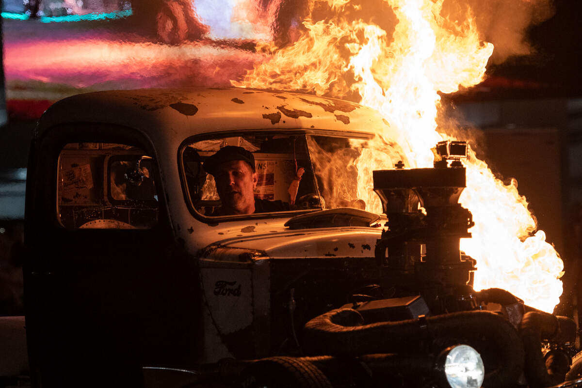 Phil Krantz, of Ordonville, Michigan, watches as his 1947 Ford catches on fire during a flame throwing competition, where drivers compete to see which car can produce the biggest flames, at Island View Casino in Gulfport during Cruisin’ The Coast on Tuesday, Oct. 3, 2023.