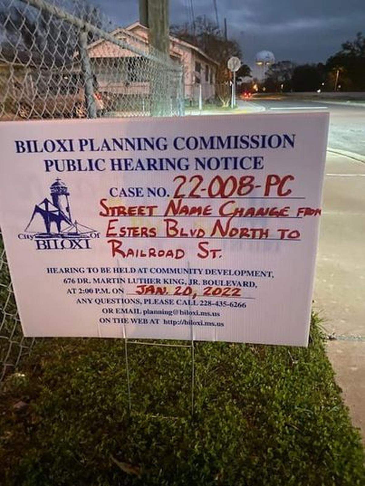 One of the signs announcing the public hearing, which has been postponed.