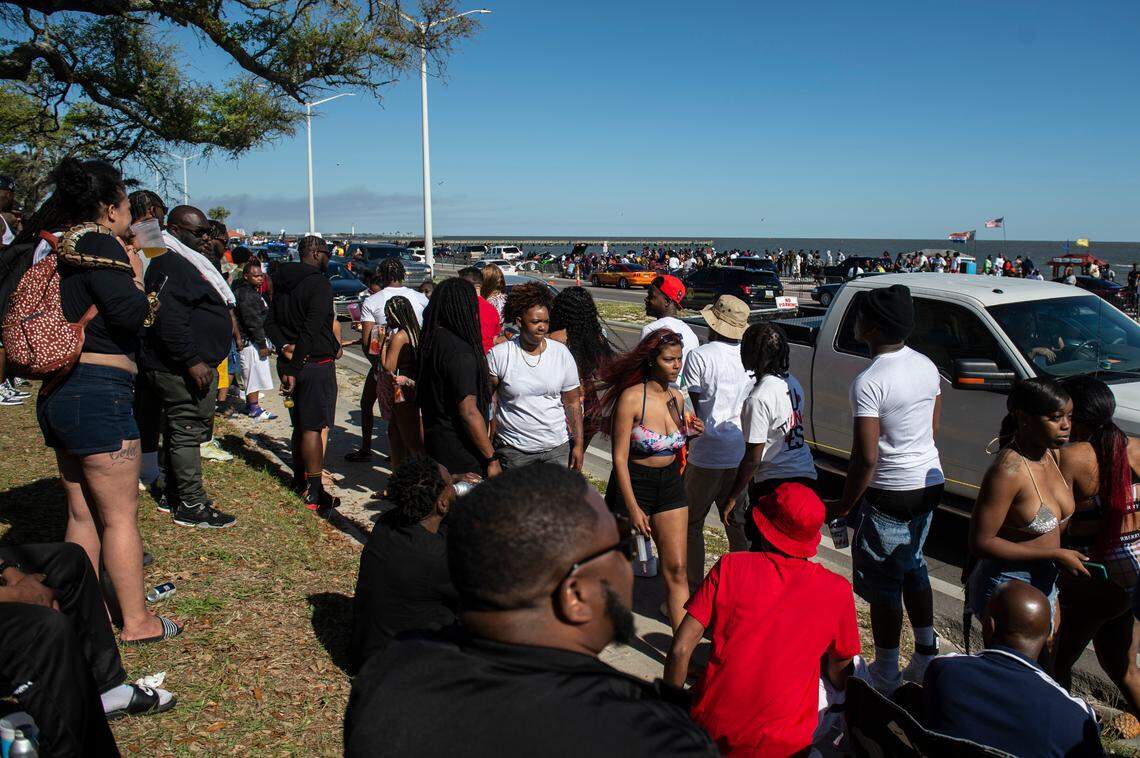 Hundreds of people walk along Highway 90 during Black Spring Break in Biloxi on Saturday, April 9, 2022.