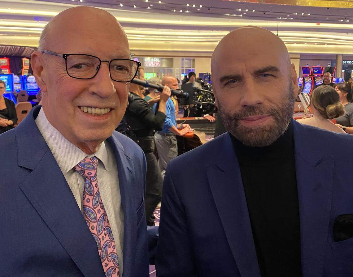 John Travolta, right, and Scarlet Pearl Casino owner Bob Granieri pose for a picture on the casino floor during filming of Travolta’s new movie “Cash Out 2” in D’Iberville and other South Mississippi locations.