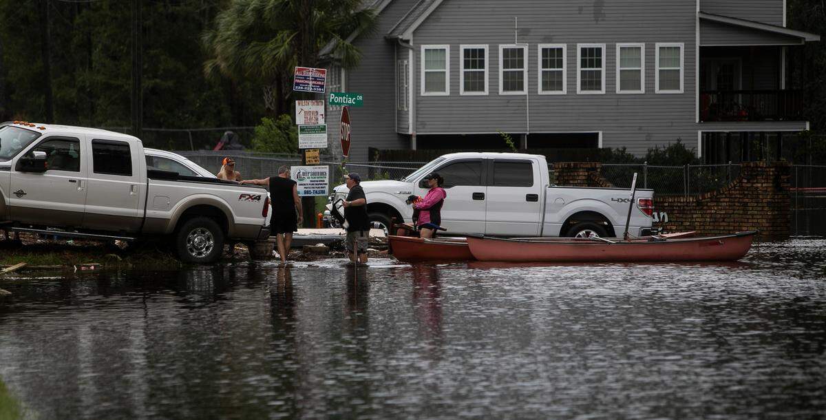 Residents of Pontiac Drive in the Jourdan River Shores community in Kiln used a canoe to get to safety after Hurricane Ida caused more than 8 feet of storm surge in the area on Aug. 30, 2021.