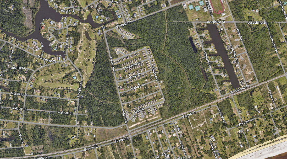 The Pass Estates subdivision includes most of the homes west of Cedar Avenue shown on the center square of this aerial screenshot from Google Earth, including the row of houses off West North Street.