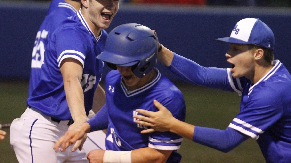 Vancleave players celebrate with Nich Sanders, center, after he scored in the third inning of their 4A baseball playoff game against West Lauderdale at Vancleave on Friday, May 4, 2018. The Bulldogs have hired Gulfport assistant Justin Edwards to take over the head coaching position.
