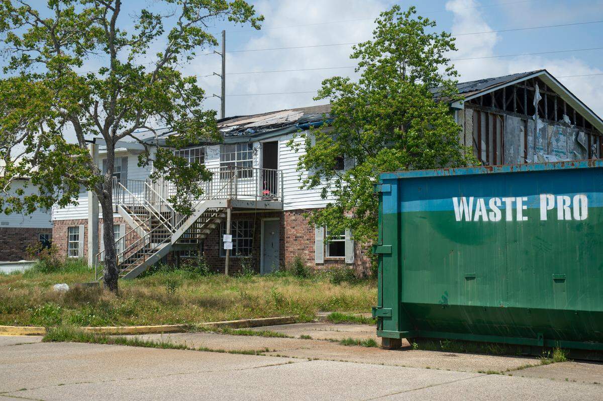 A damaged building with a missing roof at the Gulf Grove Apartments in Waveland on Friday, April 19, 2024. The city of Waveland condemned the apartments over the condition of the buildings and residents will have 30 days to move out.