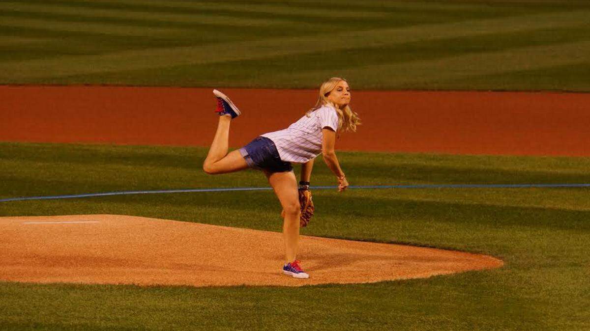 COURTESY MICHELE BELL 
 Katie Russell concluded her tour of all 30 Major League Baseball ballparks by throwing out the first pitch at the Chicago Cubs' Wrigley Field.
