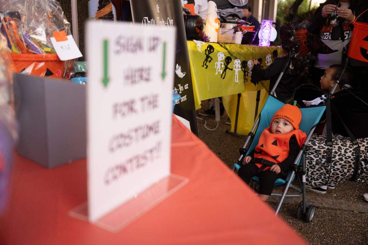 A child sits in a stroller during Boo On The Rue in Biloxi on Thursday, October 30, 2025.
