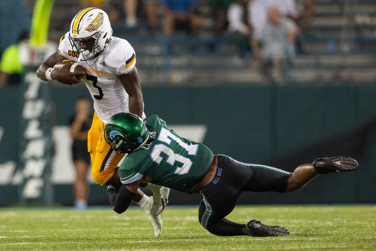 Southern Miss Golden Eagles running back Frank Gore Jr. (3) gets tackled by Tulane Green Wave safety Macon Clark (37) during a game against Tulane at Yulman Stadium in New Orleans on Saturday, Sept. 24, 2022.