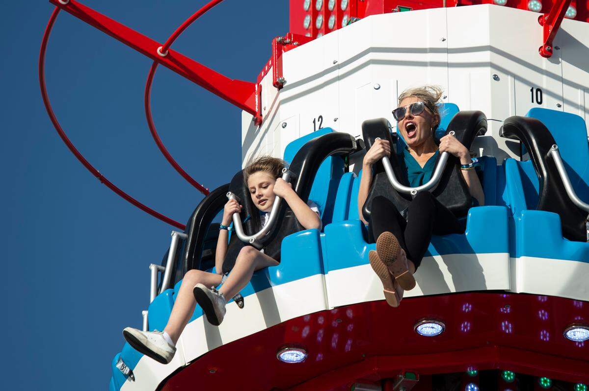 Riders yell as they ride the Buoy Blaster during the grand opening of Paradise Pier at Margaritaville in Biloxi on Friday, March 3, 2023.