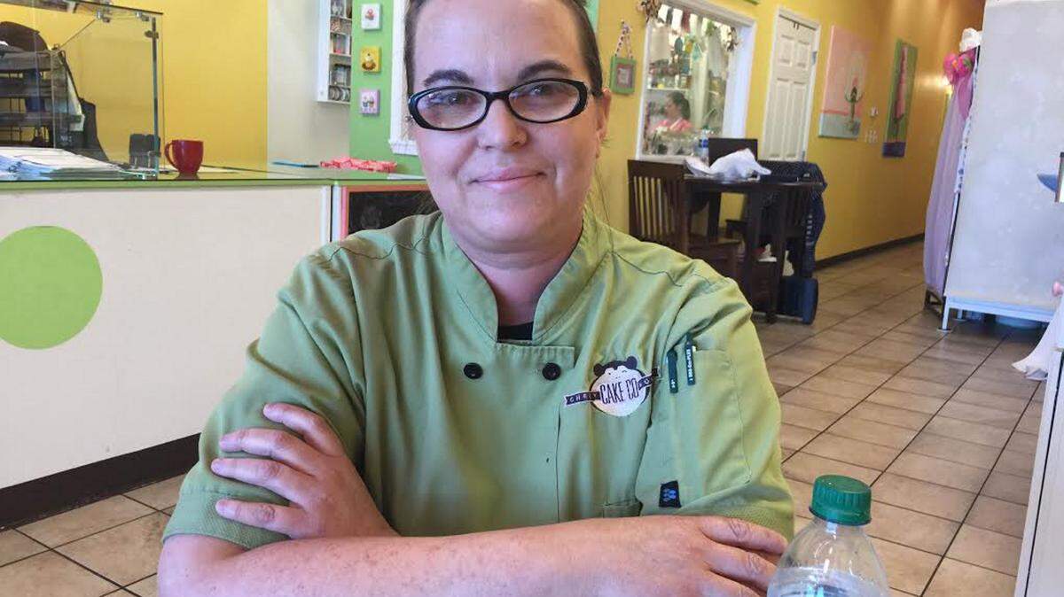 JEFF CLARK/SUN HERALD 
 Jennifer Noble, owner of Cheeky Monkey Cake Company in D'Iberville says her business does not support HB 1523.