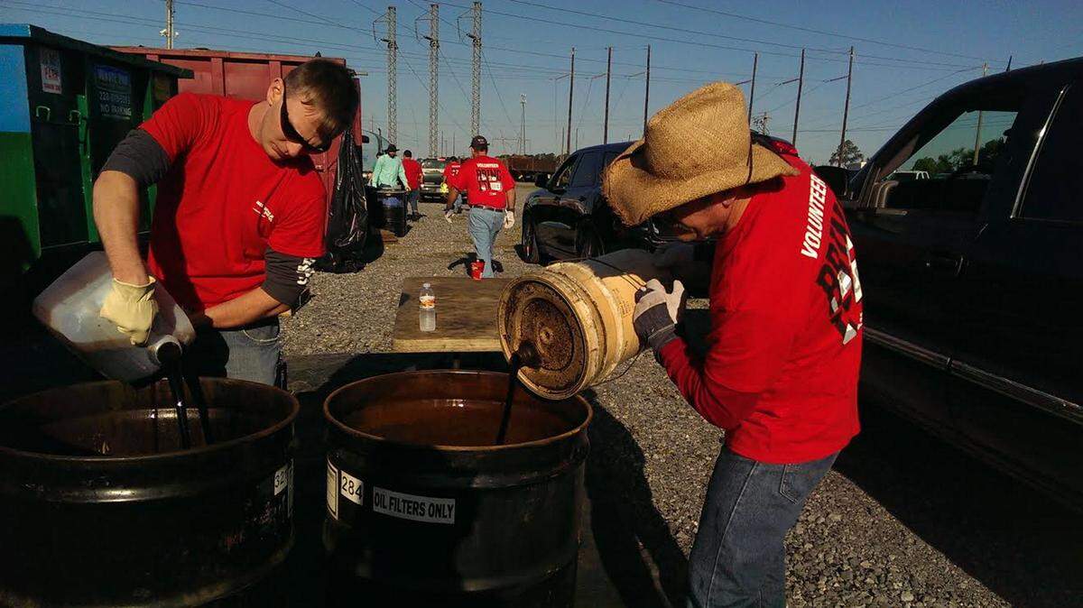 COURTESY CINDY DUVALL 
 Mississippi Power Co. employee volunteers properly dispose of used oil.