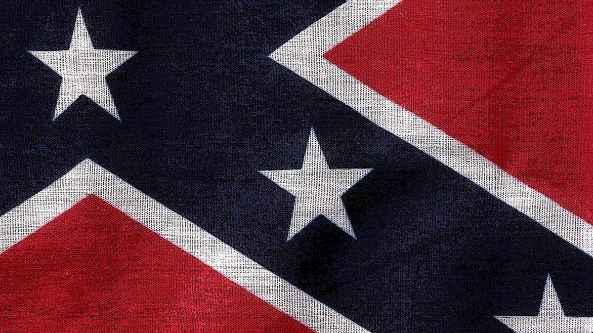 TIM ISBELL/SUN HERALDThe Confederate battle flag is on the upper left-hand corner of the Mississippi flag. The Confederate emblem, which is a symbol of divisiveness for some and a symbol of heritage for others, is the reason the state flag has been removed from college campuses in Mississippi.