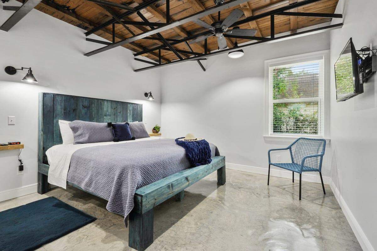 The bedrooms of the Aime’s new AirBnb feature custom, handmade wooden bed frames.