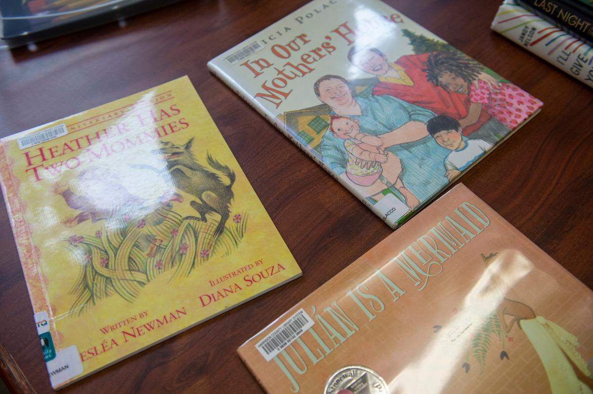 Children’s books “Heather Has Two Mommies”, “In Our Mothers’ House” and “Julian Is A Mermaid” are some of the books that were featured on a book display for pride month at West Biloxi Library during the month of June. In a Biloxi city council meeting on July 19, 2022 Colleen Tucker asked the council to remove books featured on displays in libraries throughout Harrison County, leading to a protest at a library board meeting at West Biloxi library on July 25, 2022.