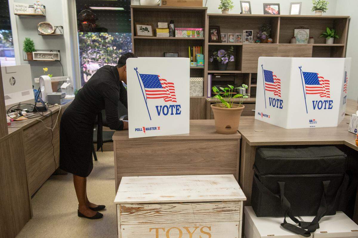 A voter makes choices at a voting precinct in Bay St. Louis on Election Day, Tuesday, Nov. 7, 2023.