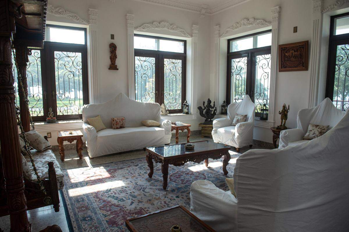 A sitting area in Binoy and Abha Mishra’s home on Scenic Drive in Pass Christian on Tuesday, May 16, 2023. The couches are covered to protect the upholstery from the Mishras’ three dogs.
