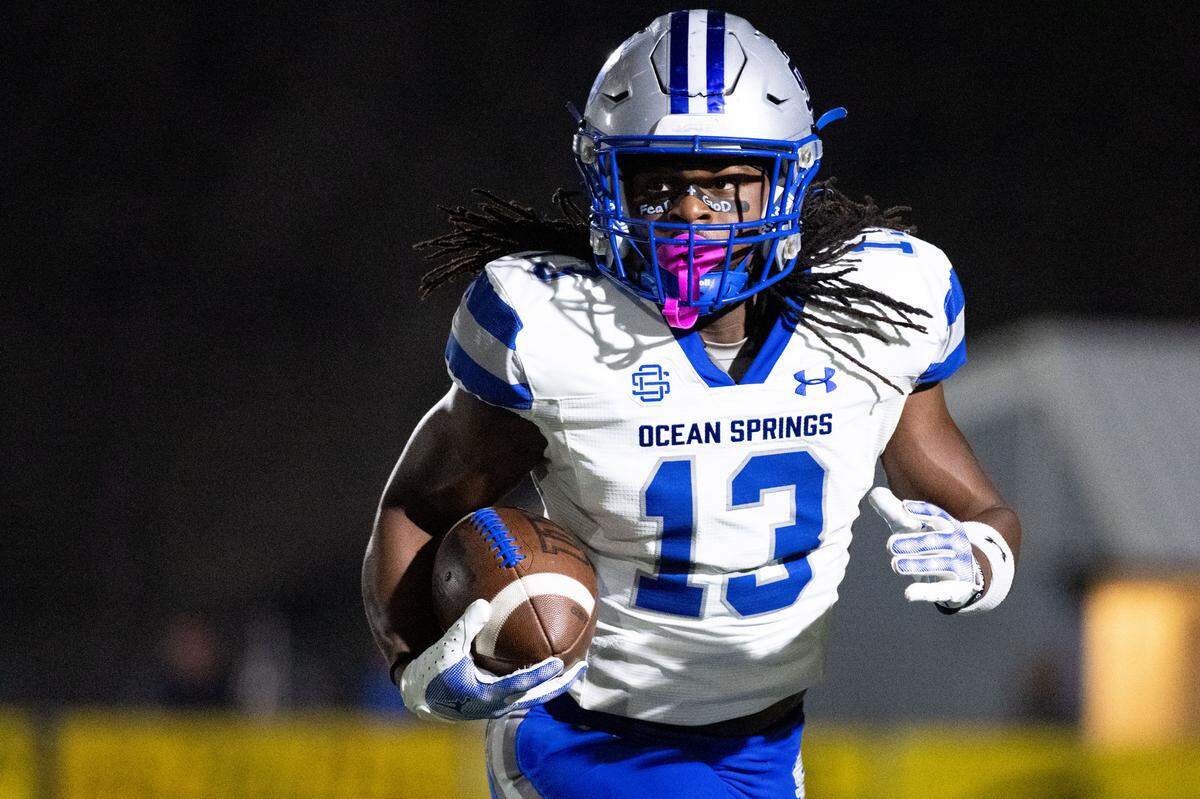 Ocean Springs running back Solomon Baggett (13) scored four touchdowns Friday in the Greyhounds’ win over D’Iberville at Buddy Singleton Field.