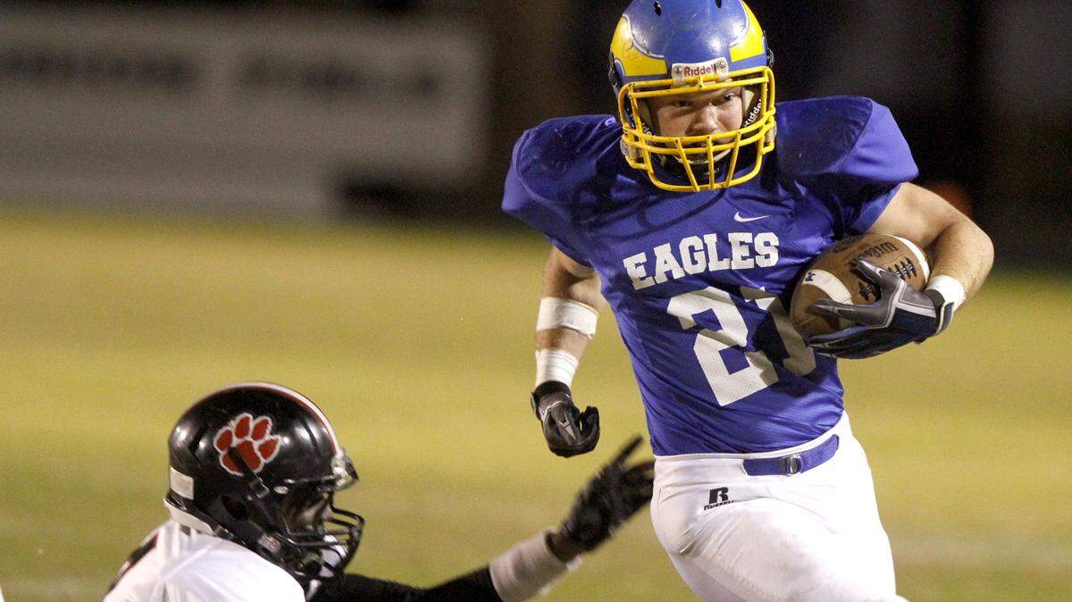TIM ISBELL/SUN HERALD 
 Justice Sharp of Resurrection races for a first down against Lumberton, Friday, Nov. 27, 2015.