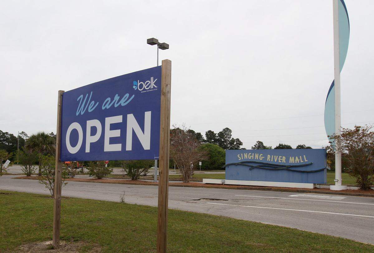 A sign tells customers that Belk is open for business at Singing River Mall in Gautier after the Singing River Mall was demolished in 2014.