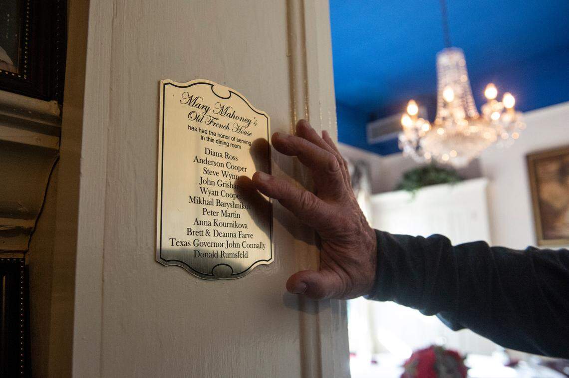 Mary Mahoney’s owner Bobby Mahoney points out the name of one of his favorite celebrity guests, Diana Ross, on a plaque listing some stars who dined in that room at the Biloxi restaurant.