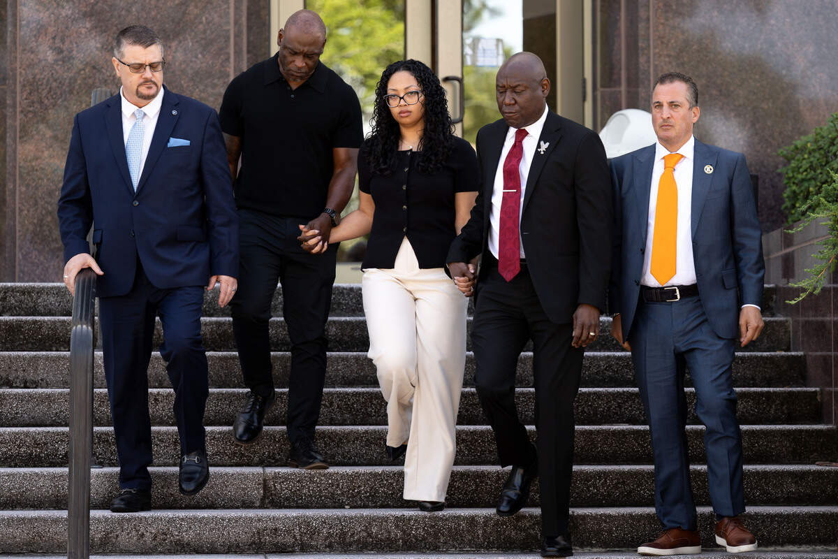 From left to right; Attorney Eric Hertz, Elmore Wonsley, Christine Wonsley and Attorney Ben Crump walk down the steps outside the Jackson County Courthouse for a press conference on Wednesday, July 15, 2026.