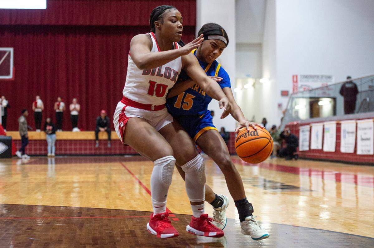 St. Martin’s Kennedi Jenkins tries to go around Biloxi’s Aubrey Hill during a game between Biloxi and St. Martin at Biloxi High School in Biloxi on Tuesday, Jan. 7, 2025.