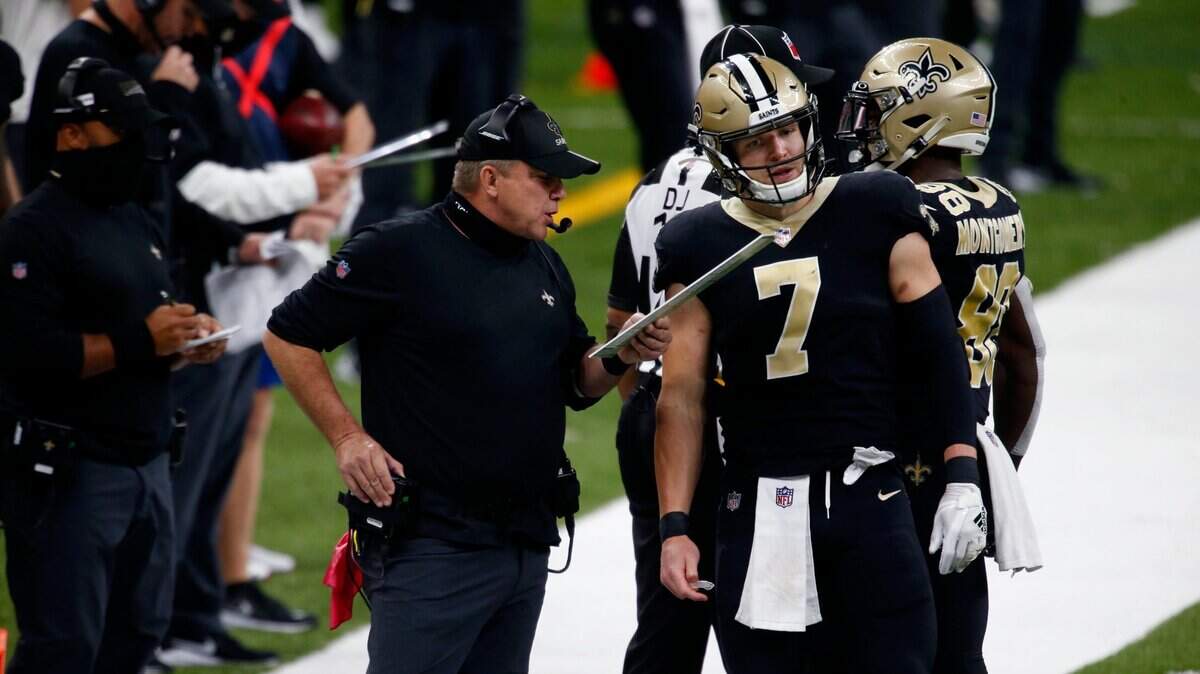 New Orleans Saints head coach Sean Payton talks to quarterback Taysom Hill (7) in the second half of an NFL football game against the Tampa Bay Buccaneers in New Orleans, Sunday, Sept. 13, 2020. (AP Photo/Butch Dill)