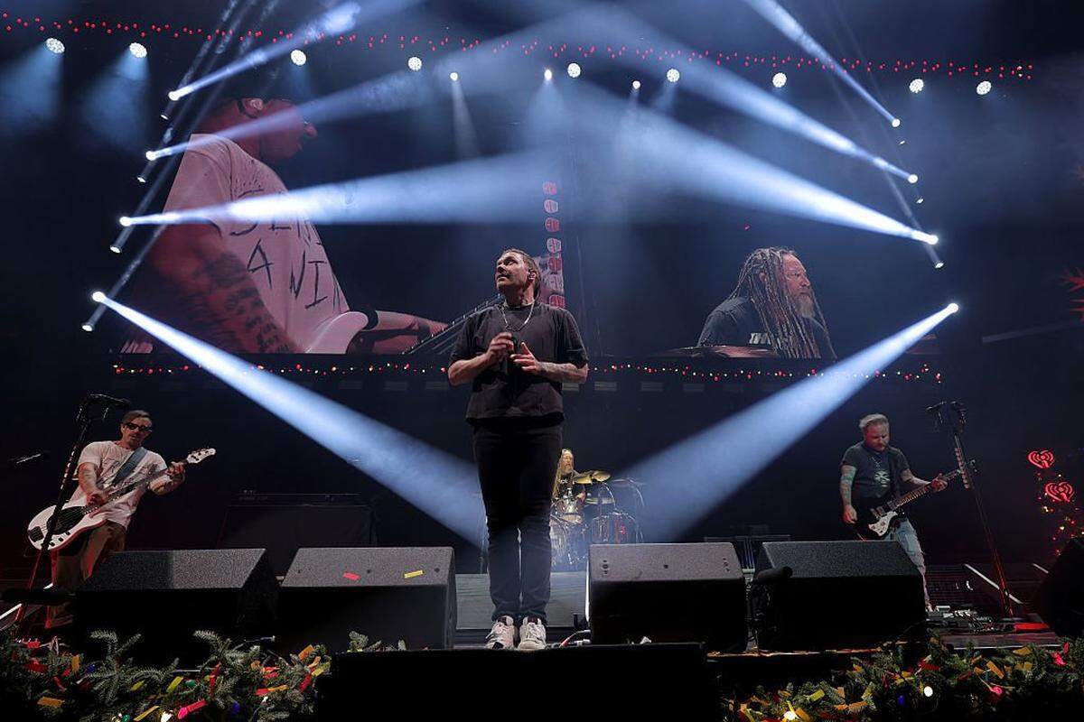 WASHINGTON, DC - DECEMBER 16: (L-R) Eric Bass, Brent Smith and Zach Myers of Shinedown perform during iHeartRadio Hot 99.5's Jingle Ball 2025 Presented By Capital One at Capital One Arena on December 16, 2025 in Washington, DC. (Photo by Michael Loccisano/Getty Images for iHeartRadio)