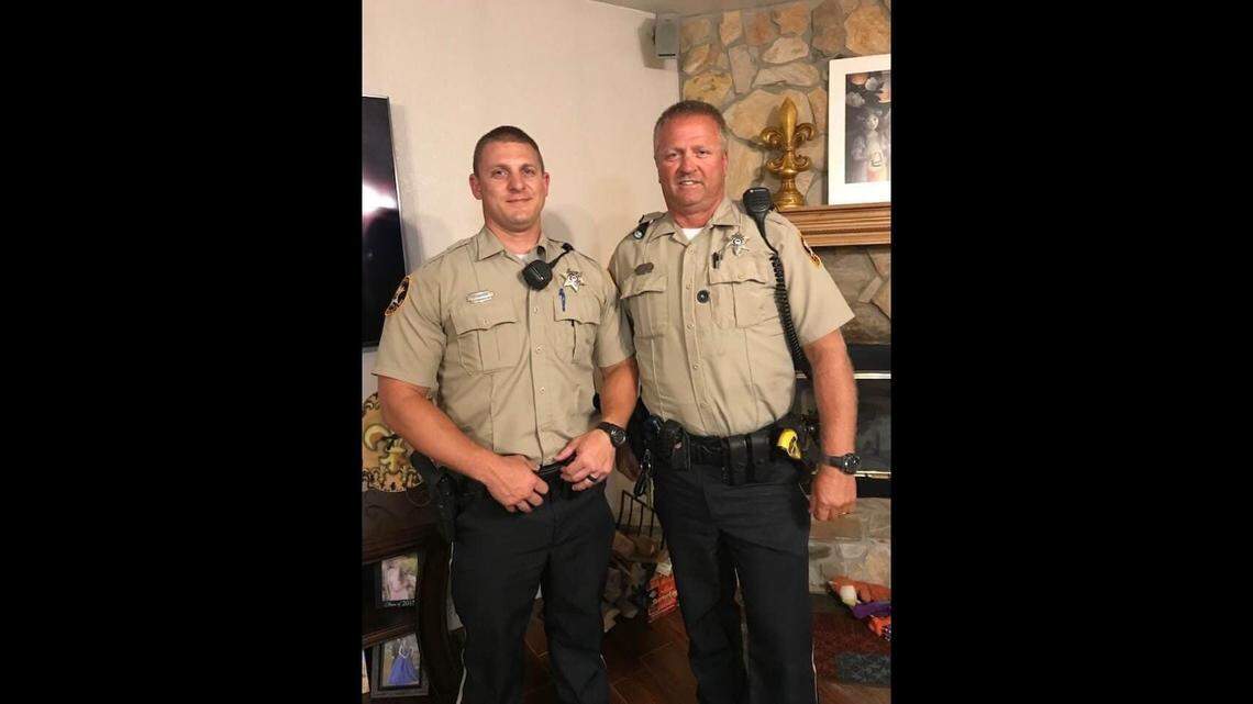 Jackson County Sheriff’s Deputy Michael Jimerson Sr., right, and his son, Michael Jimerson Jr.