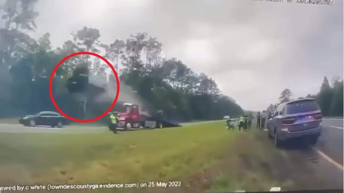 Police body camera video shows the moment a driver struck a tow truck ramp, flew into the air and flipped on State Route 38 in Georgia.