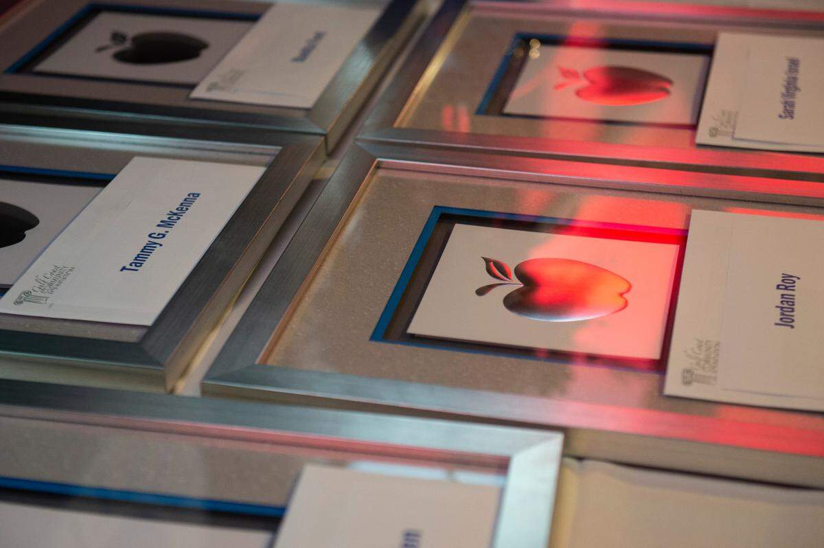 Checks and plaques for the Leo W. Seal teachers awards and grants sit on a table waiting to be handed out to recipients at the Great Southern Club in Gulfport on Friday, Aug. 26, 2022.