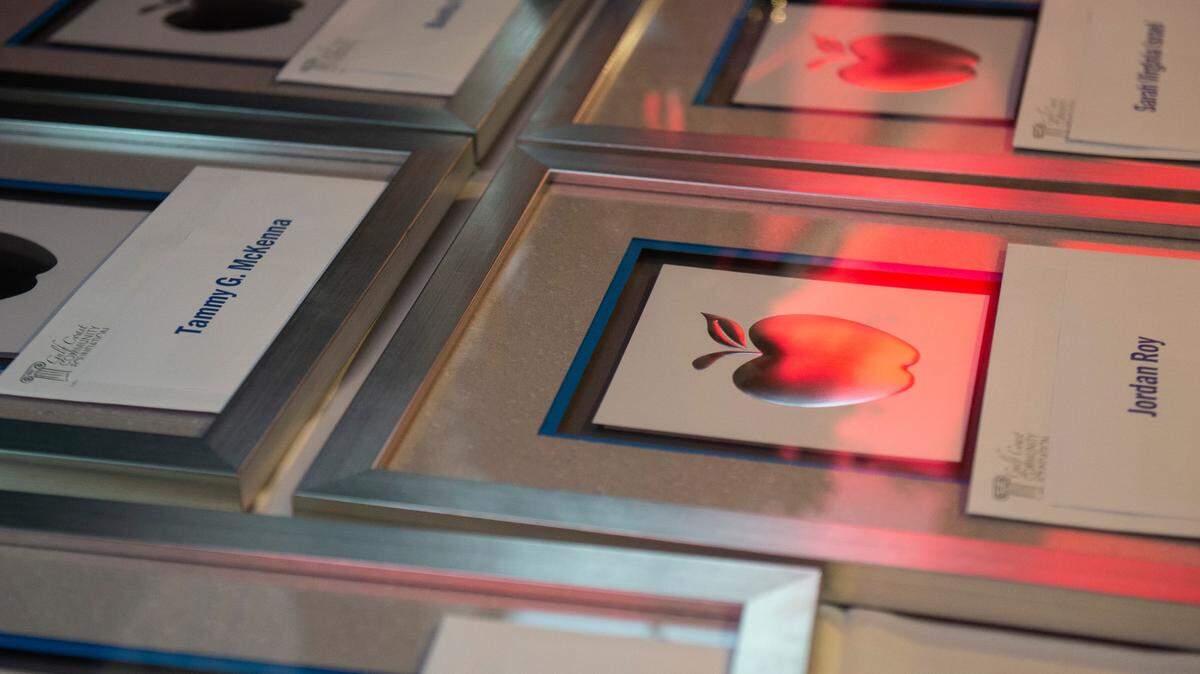 Checks and plaques for the Leo W. Seal teachers awards and grants sit on a table waiting to be handed out to recipients at the Great Southern Club in Gulfport in this 2022 file photo.