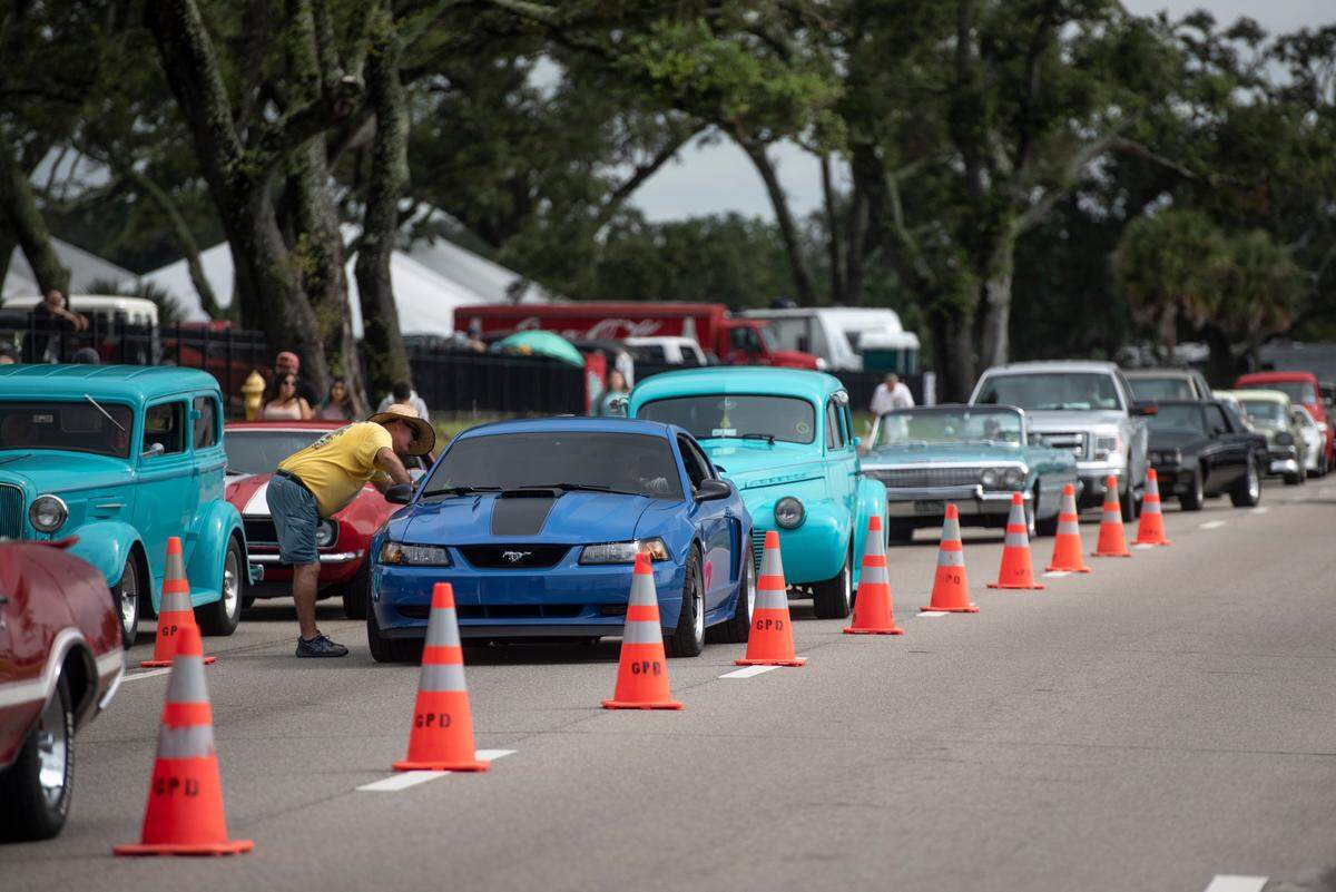Orange cones section off cruisers from the rest of traffic on Highway 90 as cars arrive at Centennial Plaza in Gulfport for Cruisin’ The Coast on Monday, Oct. 4, 2021. The cones will also be placed along the highway in Biloxi Friday to provide a lane, if needed, for emergency access.